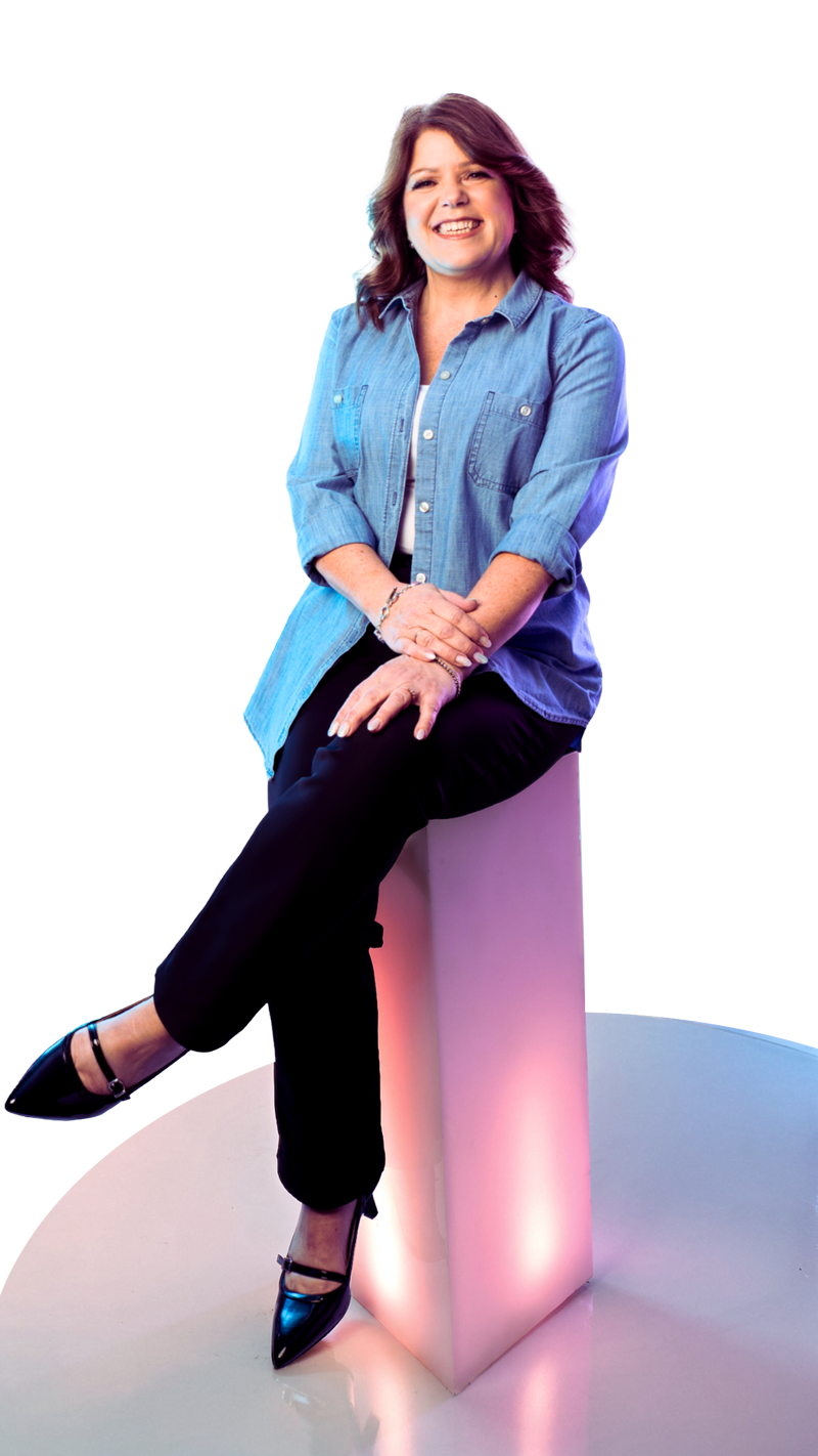 A woman (Theresa) does the Rosie Riveter pose with a bandana on her head.